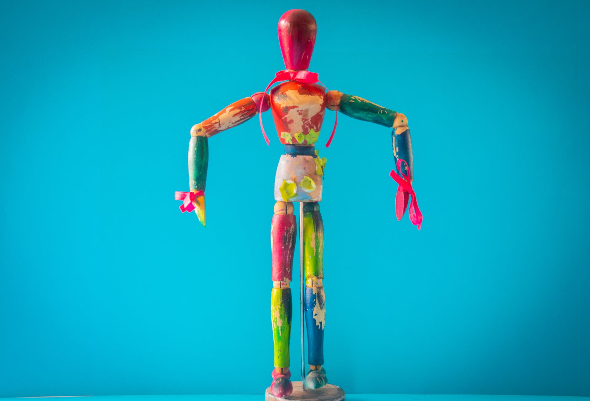 selective focus photo of multicolored wooden mannequin